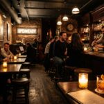 Intimate vintage 1920s Prohibition speakeasy lounge in Greenwich Village with exposed brick, mahogany bar, and glowing candlelight