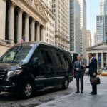 Luxury black executive Mercedes Sprinter van parked in Wall Street Financial District with business executives